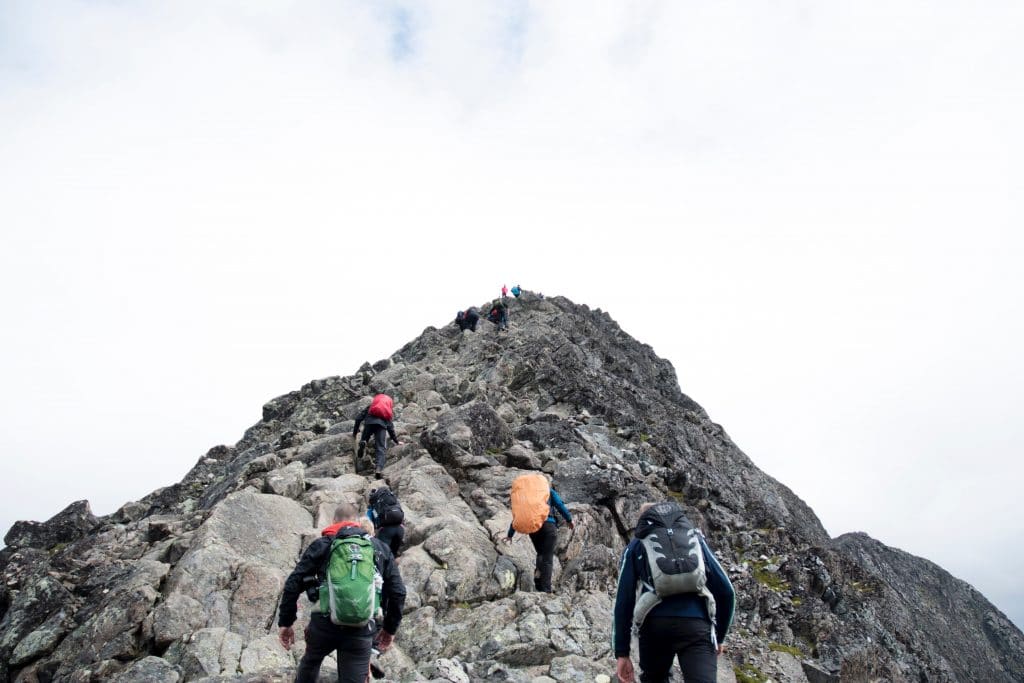 People climbing a mountain as a metaphor for leadership development